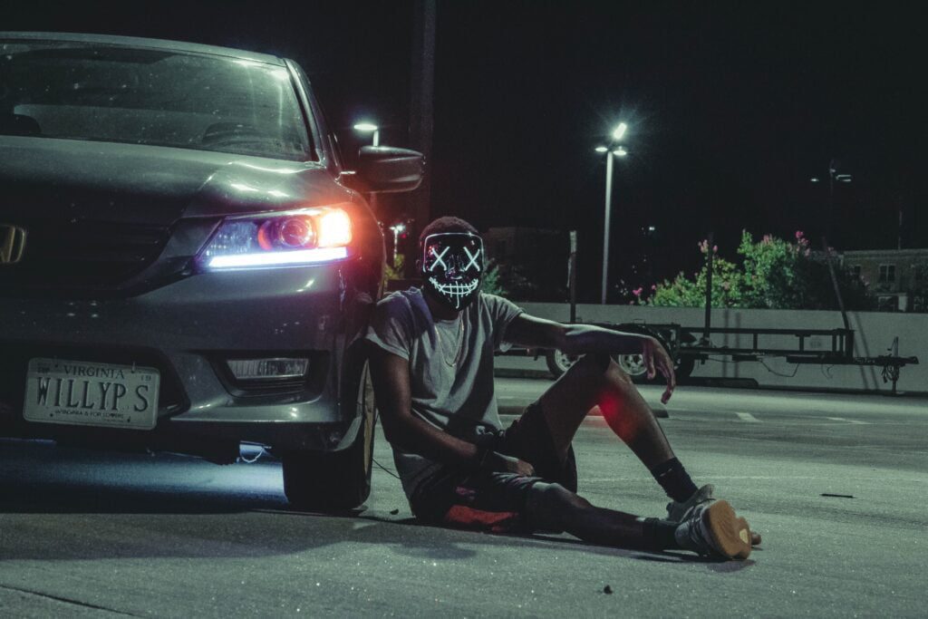 scary man with a mask beside car