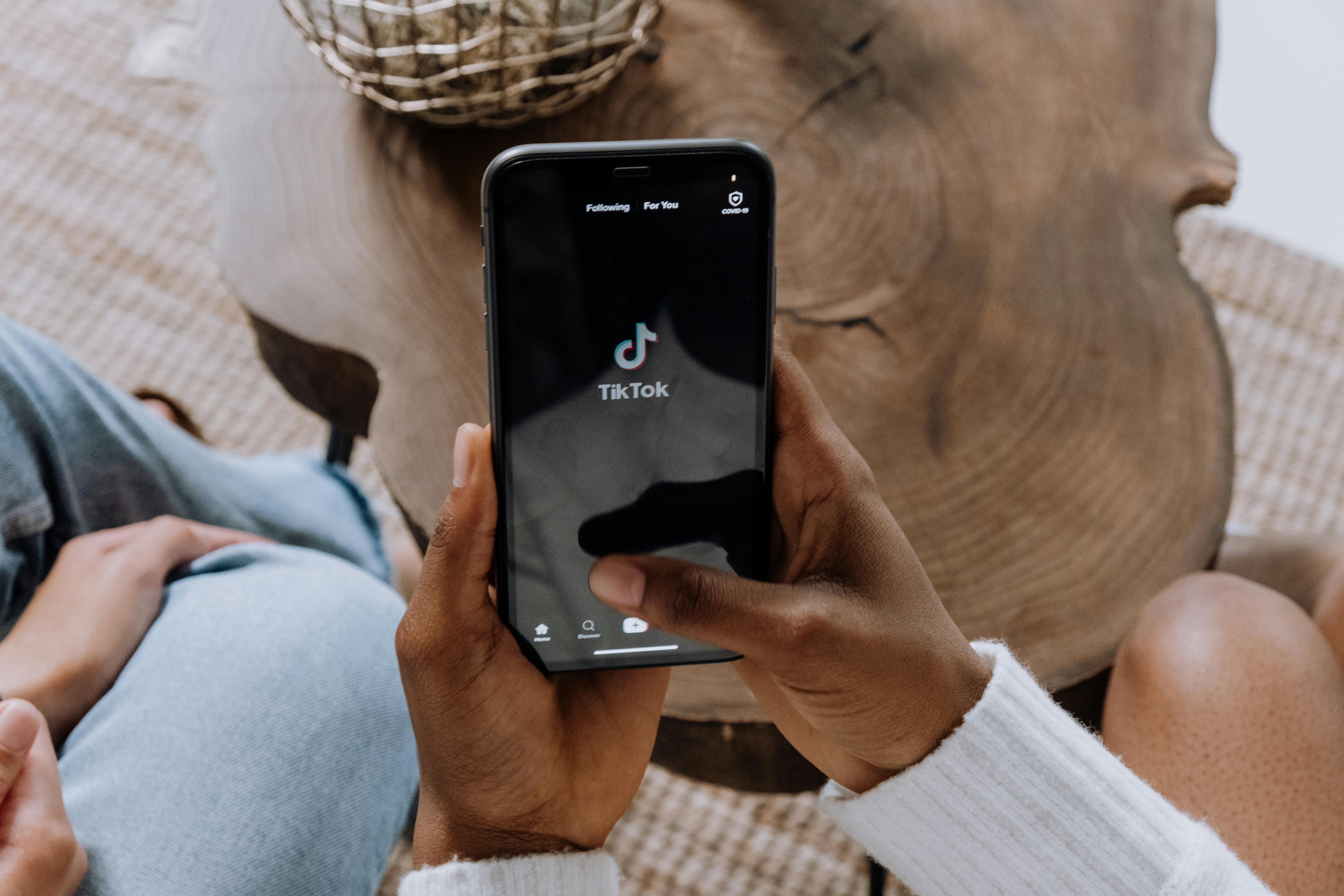 Person Holding Black Android Smartphone Stock Photo